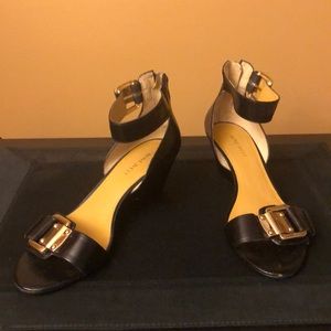 Black leather sandals with wedge heel